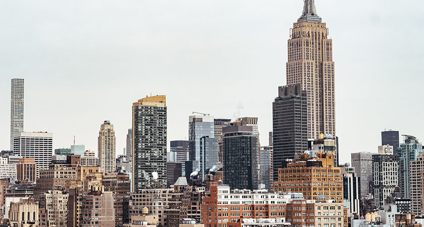 Image of a city skyline with skyscrapers that’s an example of a business hub for global entities in need of employer of record services.