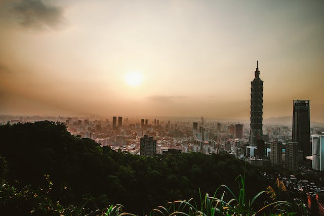 A horizon view of Taiwan showing nature as well as skyscrapers, highlighting Taiwan’s contribution to the East Asia market.