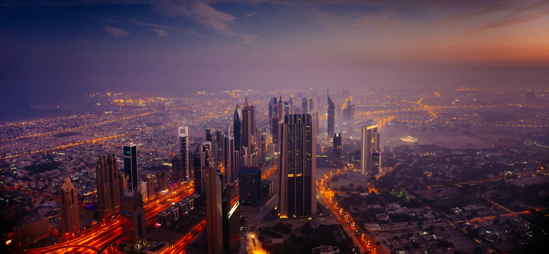 Modern city skyline at dusk, representing global business expansion