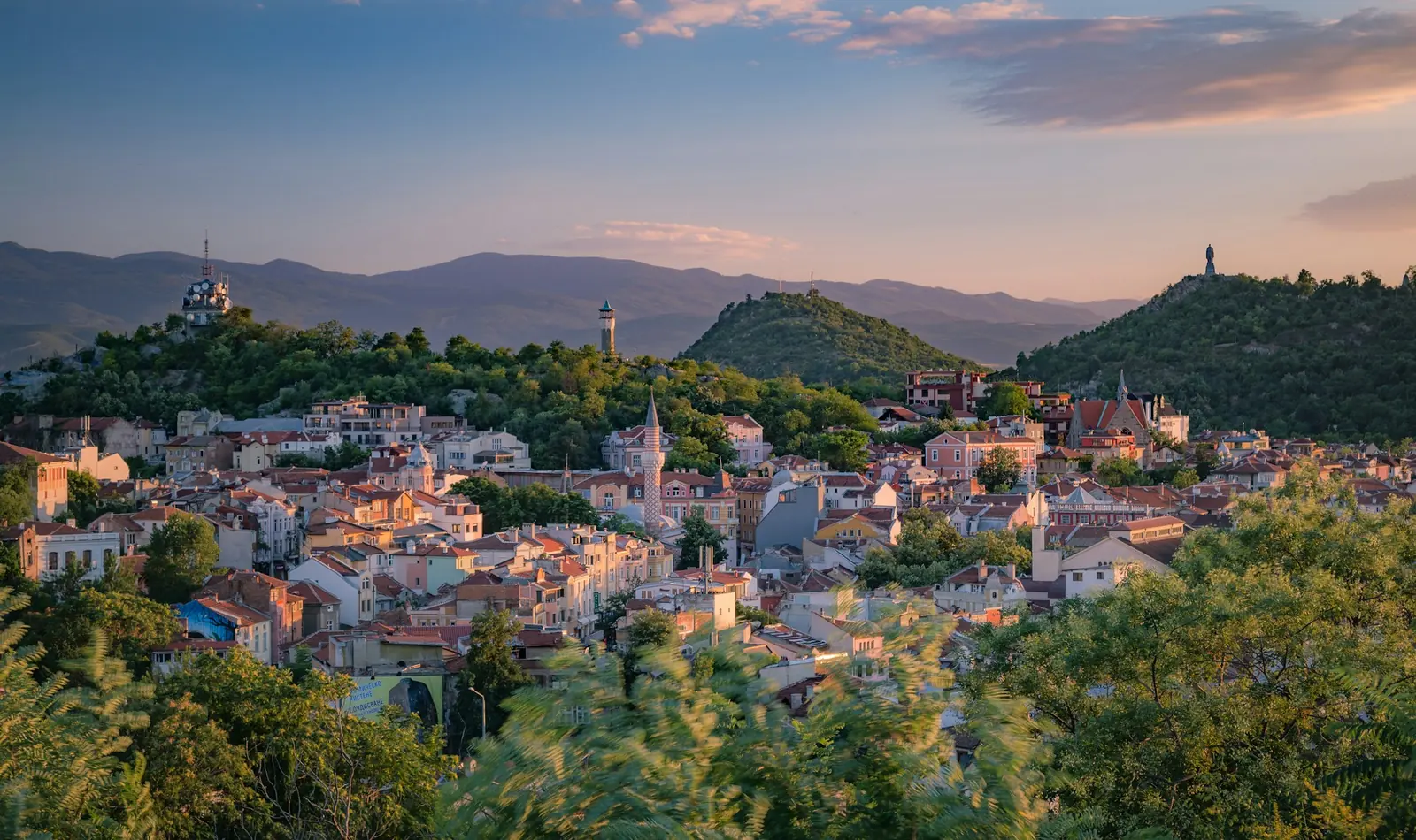 Plovdiv old town rooftops at sunset with the Rhodope Mountains, Bulgaria