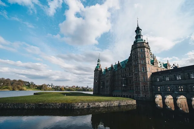 Frederiksborg Castle reflected in its lake in Hillerod, Denmark