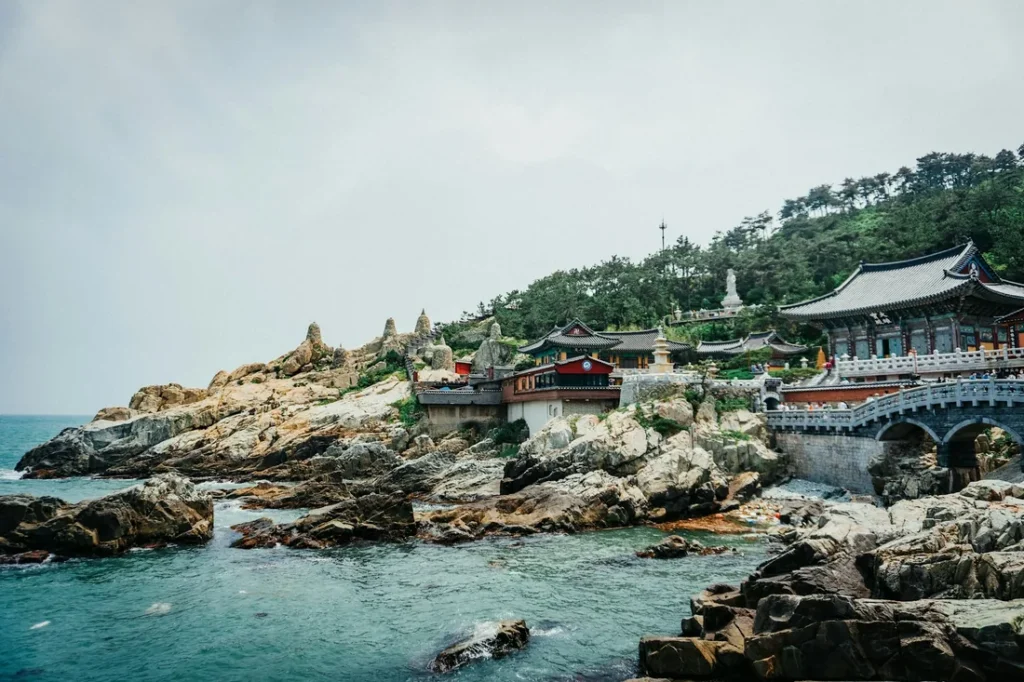 Haedong Yonggungsa temple and its pavilions on the rocky coastline above the sea near Busan, South Korea