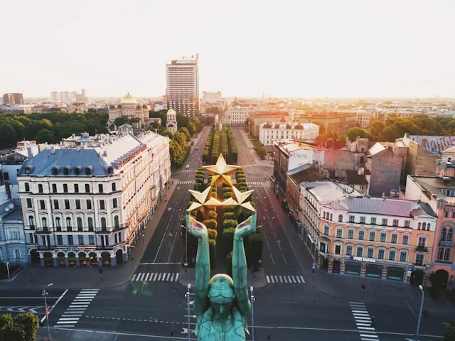 The Freedom Monument seen from above over central Riga at sunrise, Latvia