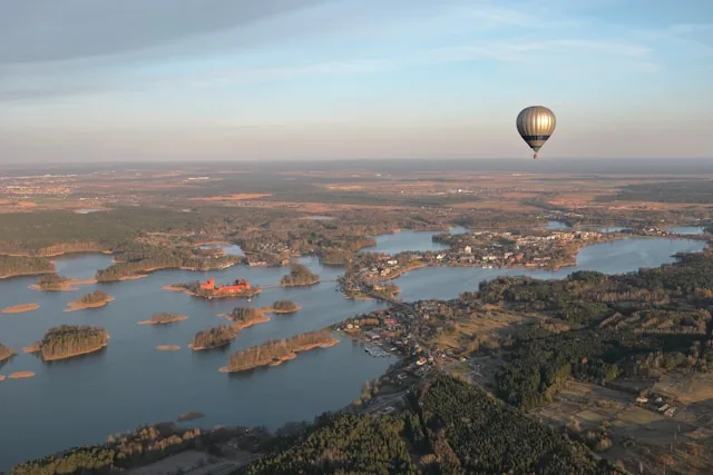 A hot air balloon over the lakes and island castle of Trakai, Lithuania