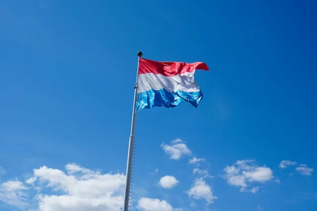 The Luxembourg flag flying against a blue sky, Luxembourg