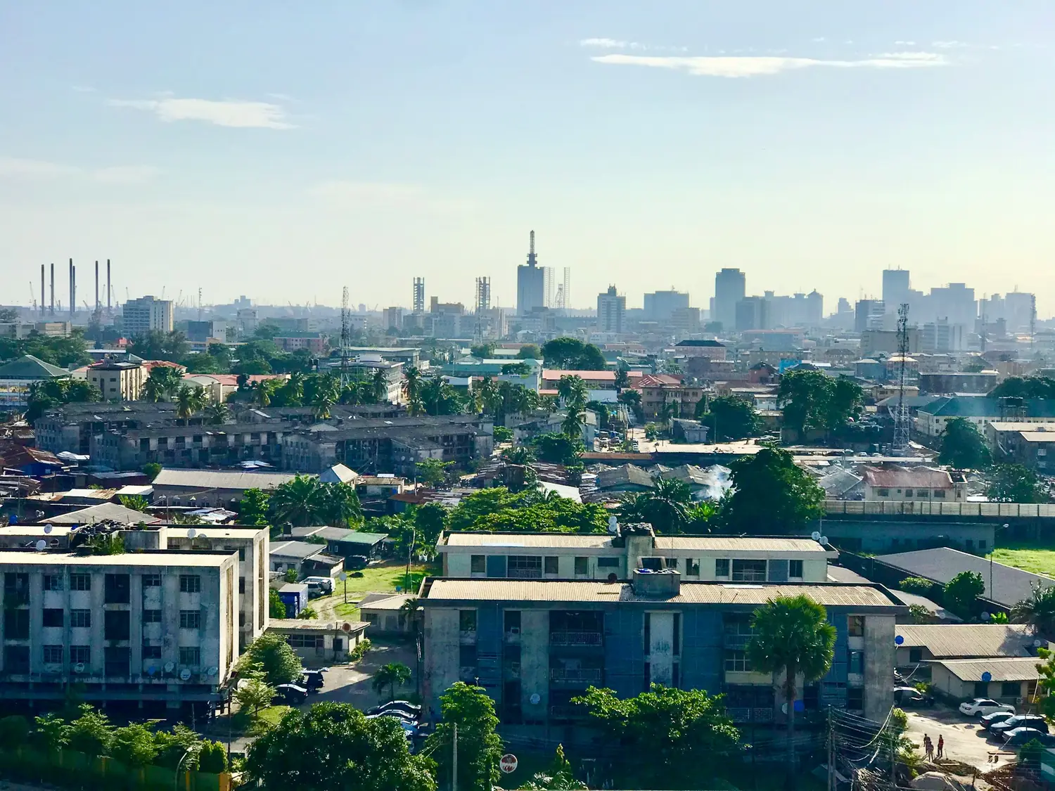 Aerial view across Lagos, Nigeria, with the city skyline on the horizon