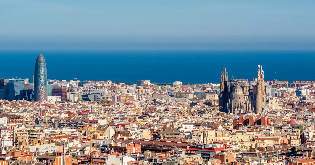 Barcelona rooftops with the Sagrada Familia — TopSource Worldwide Spanish payroll team
