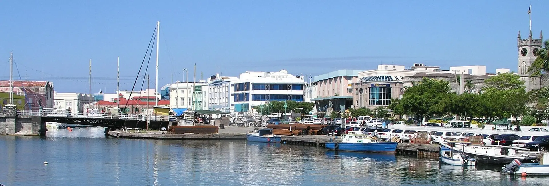 The Careenage in Bridgetown with the Chamberlain Bridge, Chamberlain Place and the Parliament Buildings clock tower, Barbados