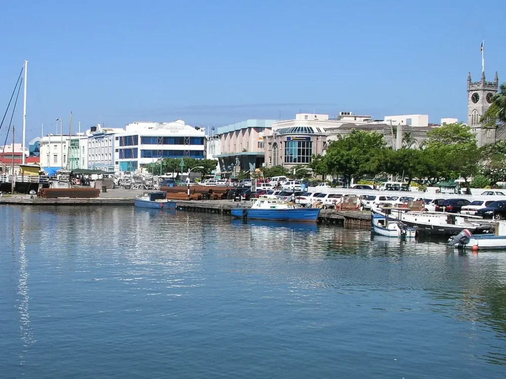 Boats moored along the Careenage in central Bridgetown, with the Parliament Buildings clock tower on the right, Barbados