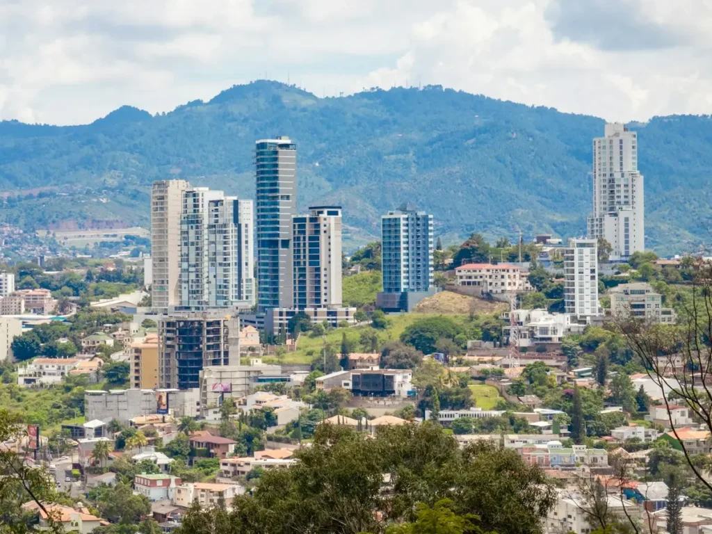 High-rise towers above the hillside neighbourhoods of Tegucigalpa, with mountains behind, Honduras