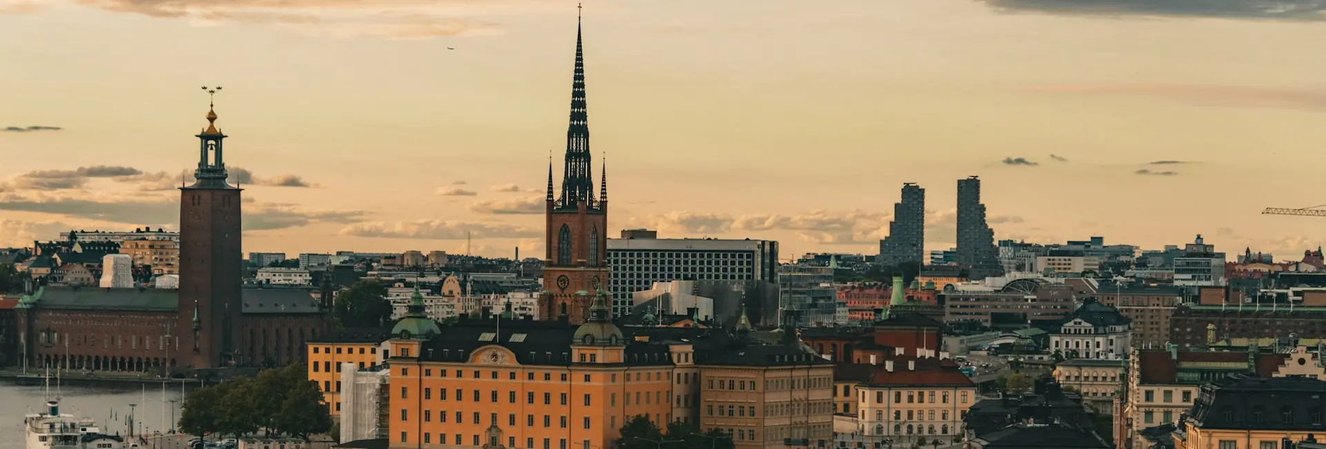 Stockholm skyline at sunset with the City Hall, Riddarholmen Church and the Norra Tornen towers, Sweden