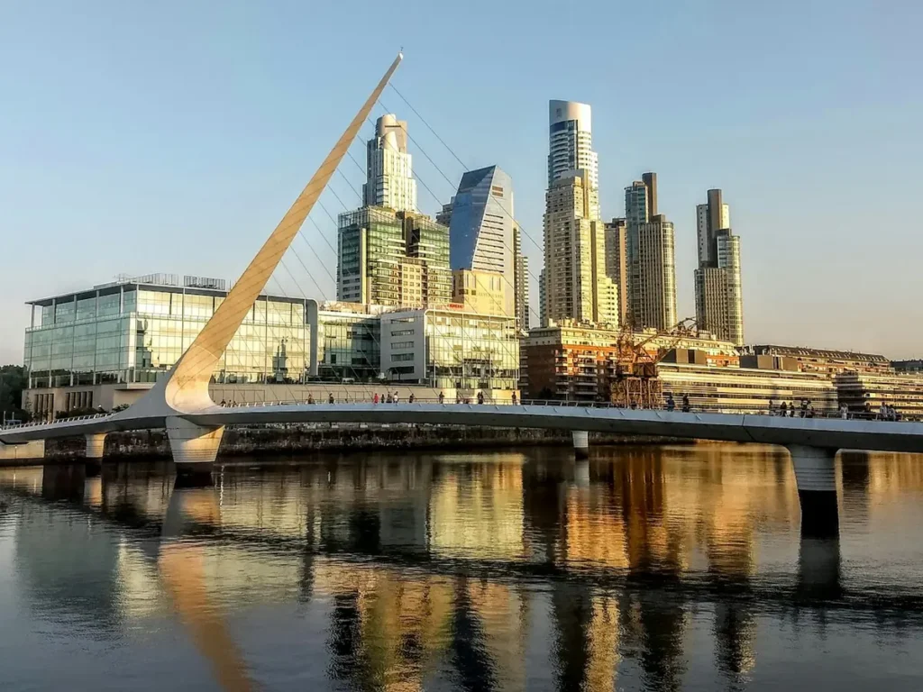 The Puerto Madero towers and Puente de la Mujer reflected in the dock, Buenos Aires, Argentina