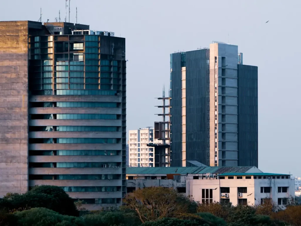 Office buildings above the trees in Motijheel, Dhaka, Bangladesh