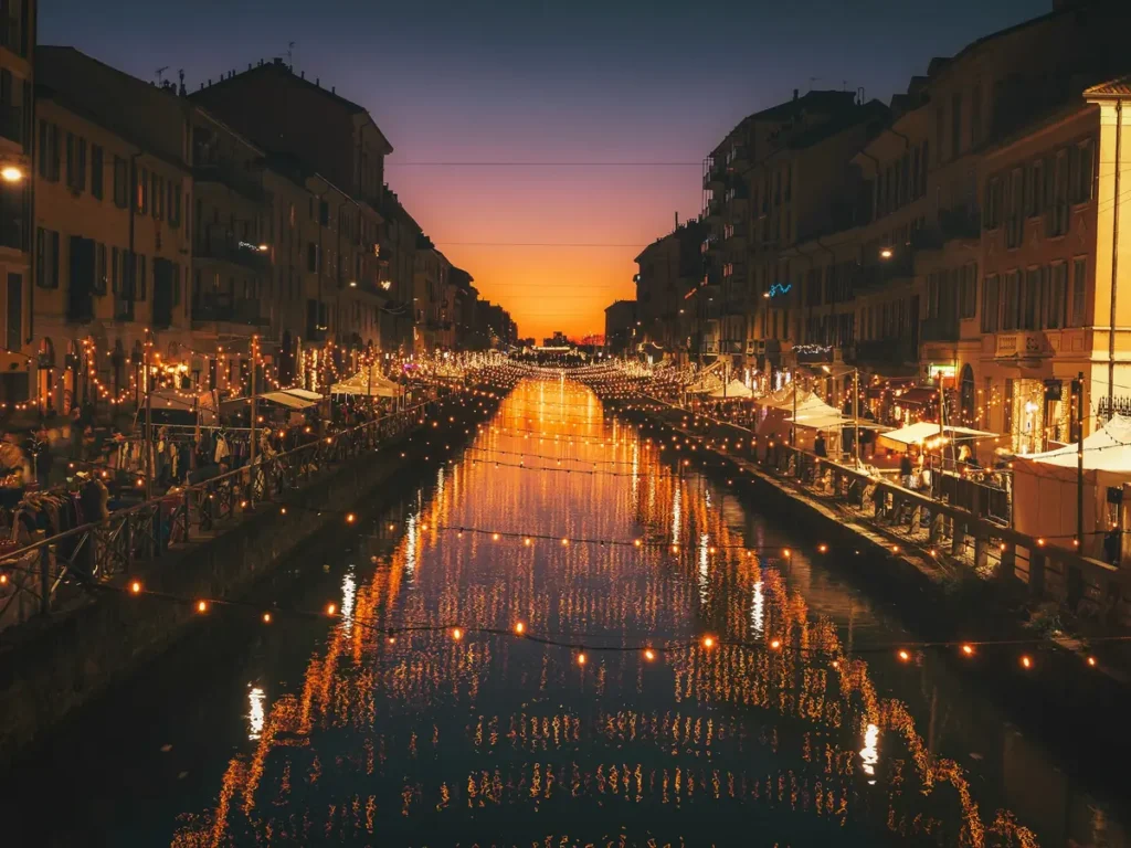 A Navigli canal lit up at dusk, Milan, Italy