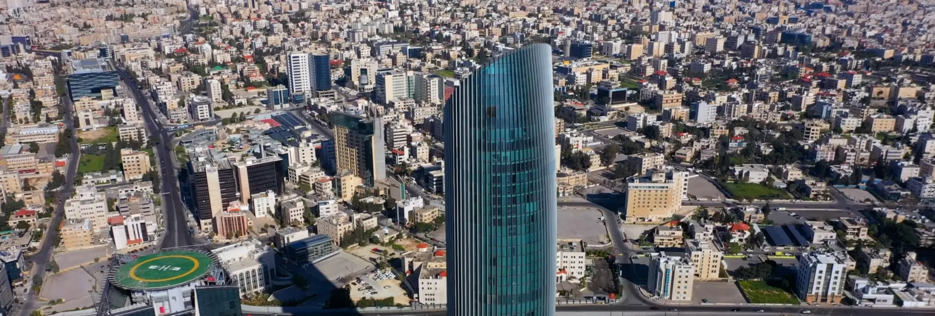 Aerial view of the Abdali district of Amman, with glass towers above the city's hillside neighbourhoods, Jordan