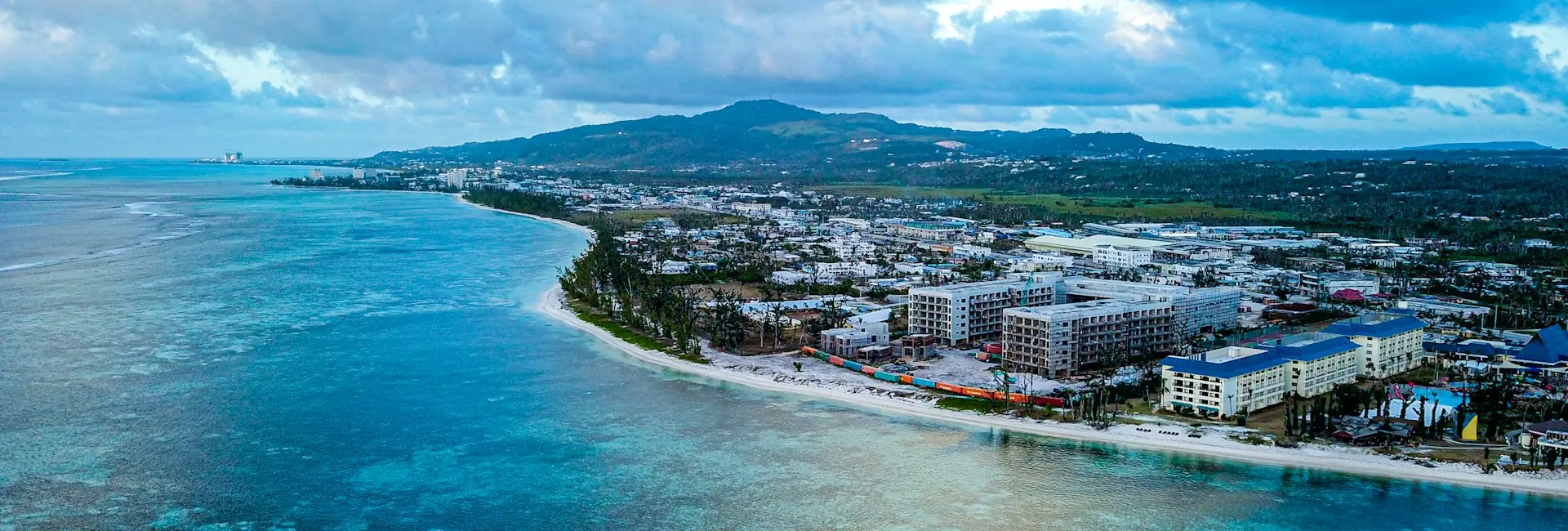 Aerial view of hotels and houses along the beach and lagoon of Saipan, Northern Mariana Islands